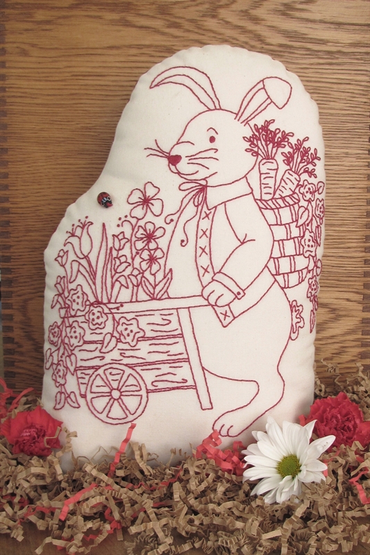 A Perky Bunny Door Stop Pushing a Flower Cart to Hold Your Door.