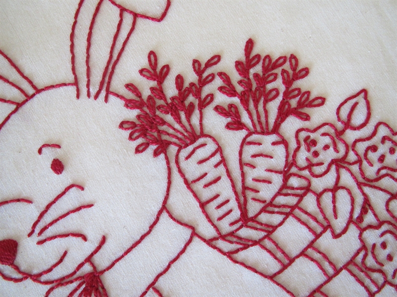 A Perky Bunny Door Stop Pushing a Flower Cart to Hold Your Door.