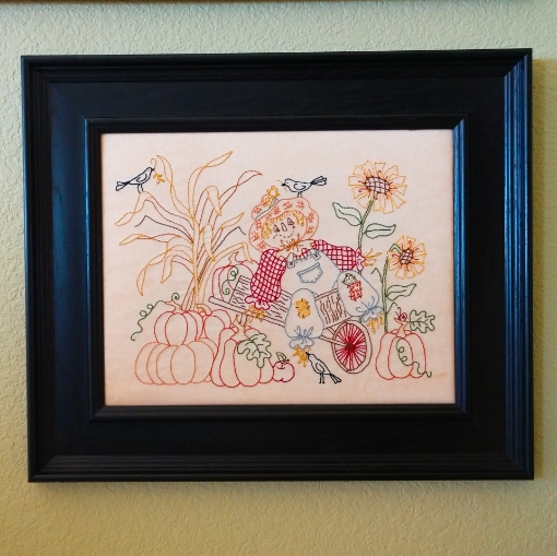 Picture of Scarecrow In Wheelbarrow - in Black Frame
